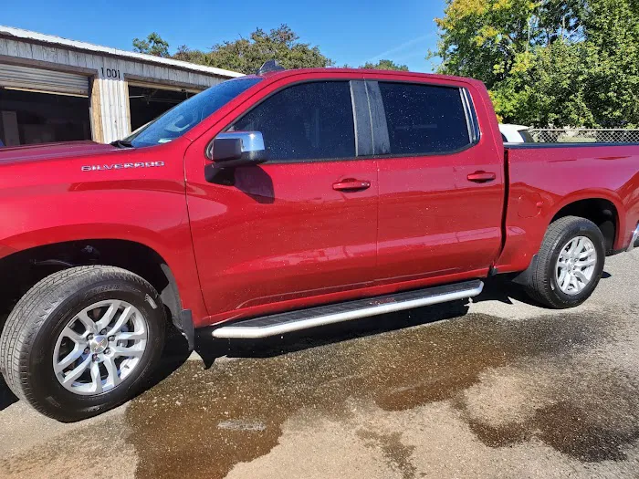Red Chevrolet Silverado with tinted windows at 1001 Wiles Road