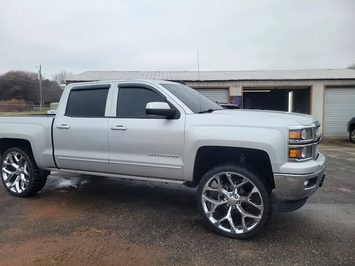 Silver Chevrolet Silverado outside the DB shop